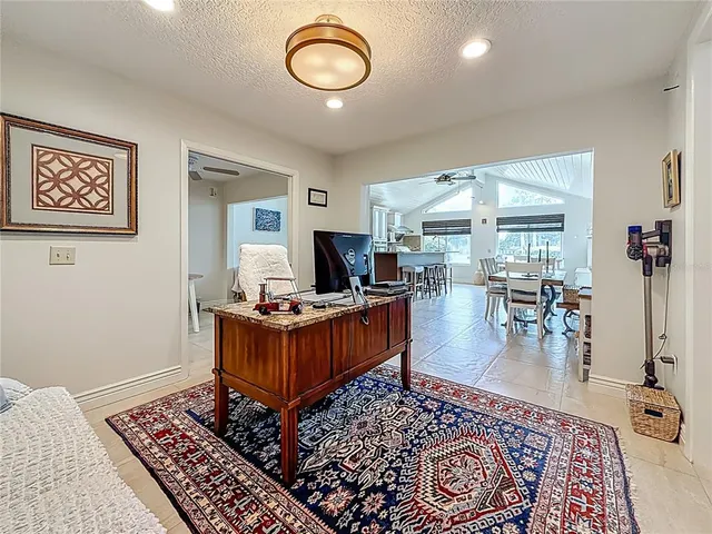 a kitchen with stainless steel appliances granite countertop a refrigerator and microwave