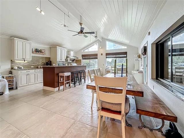 a bedroom with a bed closet and a flat tv screen