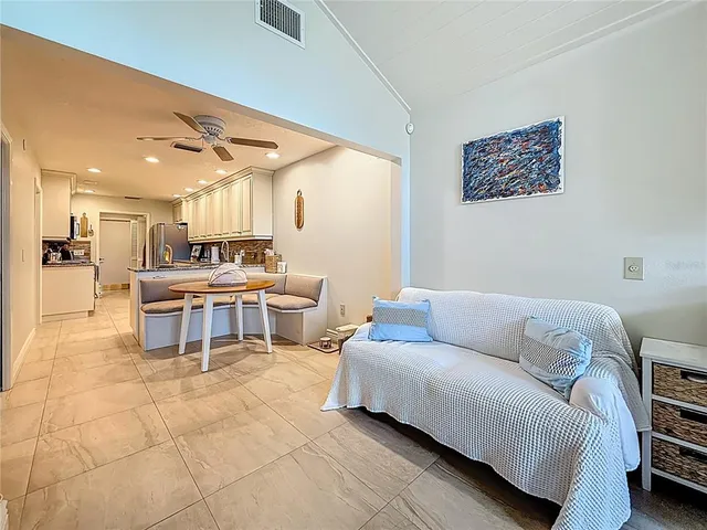a spacious bathroom with a double vanity sink large mirror and a bathtub