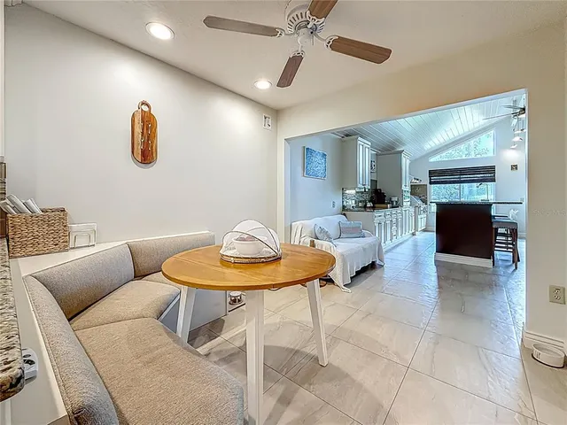 a bedroom with a bed and a book shelf