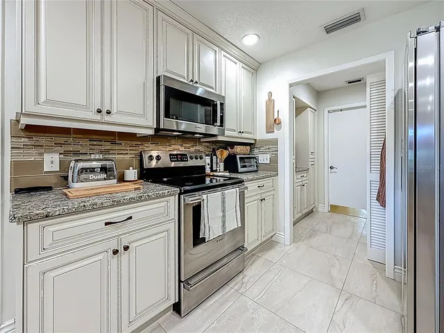 a view of a garage with an bike and car