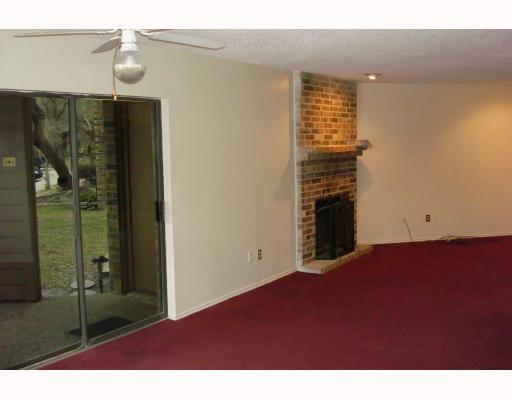 7122 Premont Drive, Unit 101F Corpus Christi, TX 78414 - Photo 2 of 8 a view of empty room with floor to ceiling window and ceiling fan