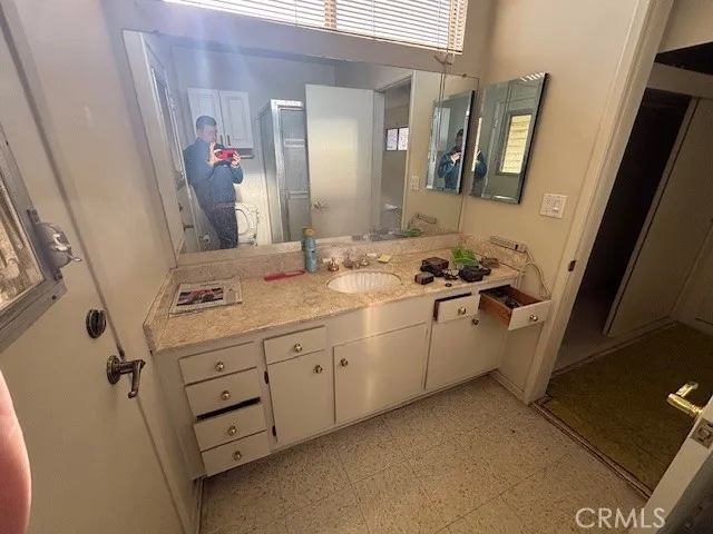 a bathroom with a sink and a mirror