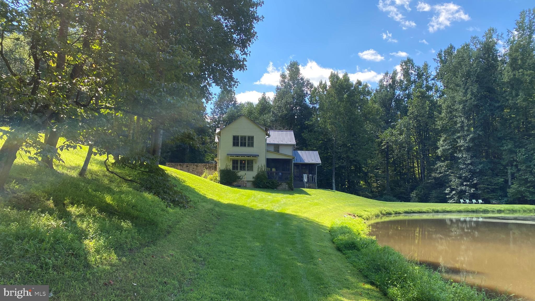 135 Sharp Rock Road Sperryville, VA 22740 - Photo 1 of 58 House and Pond