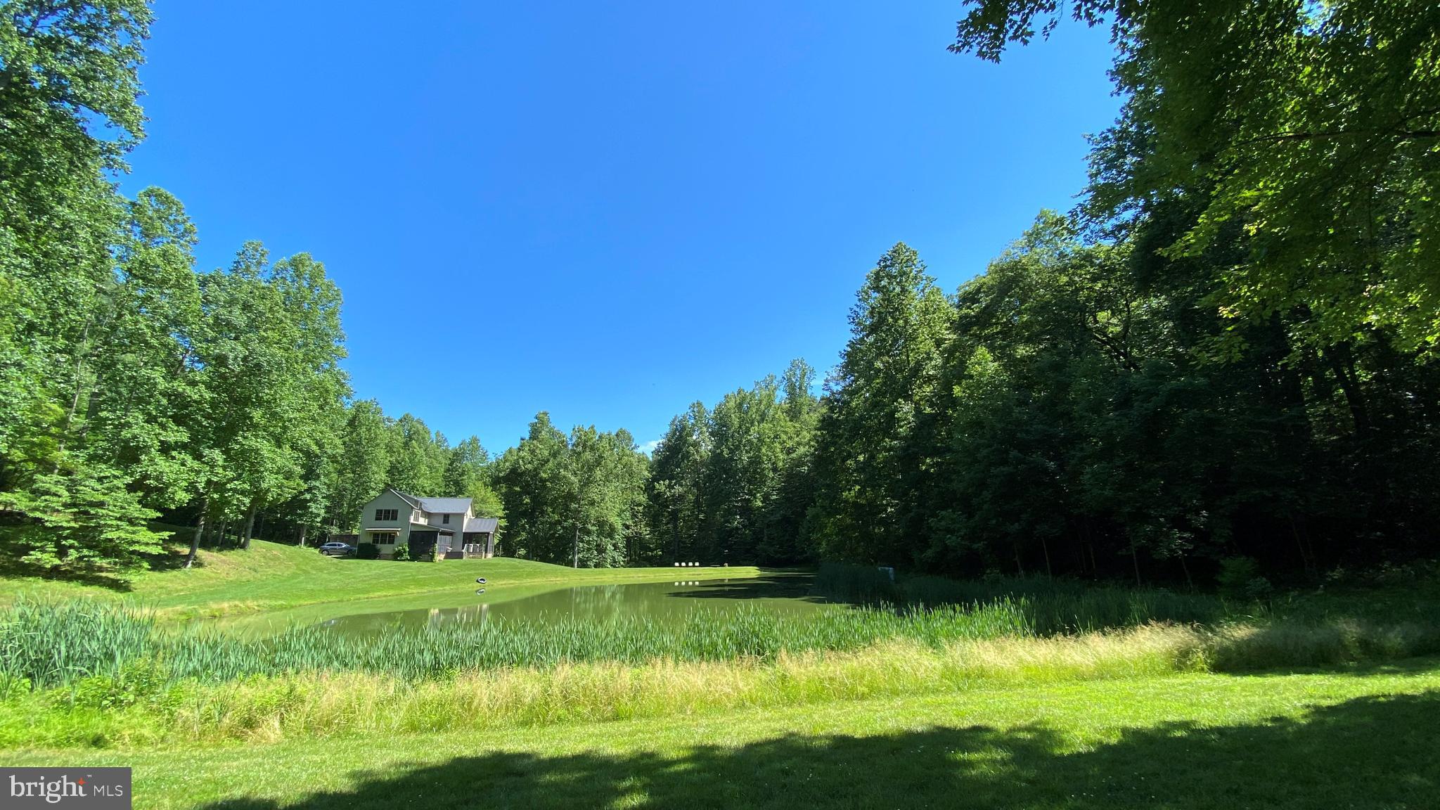 135 Sharp Rock Road Sperryville, VA 22740 - Photo 18 of 58 View of house from across pond