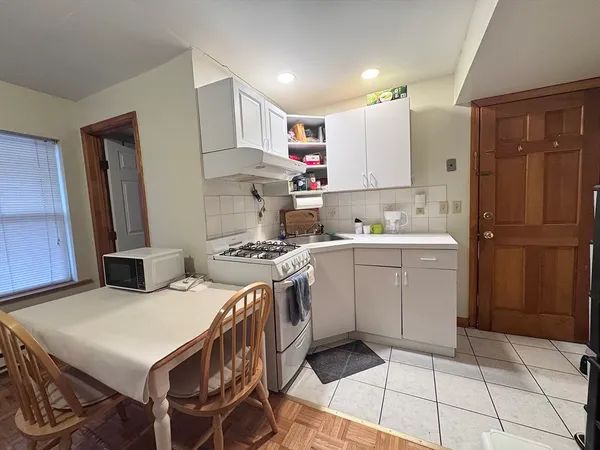 a kitchen with a sink a stove and refrigerator