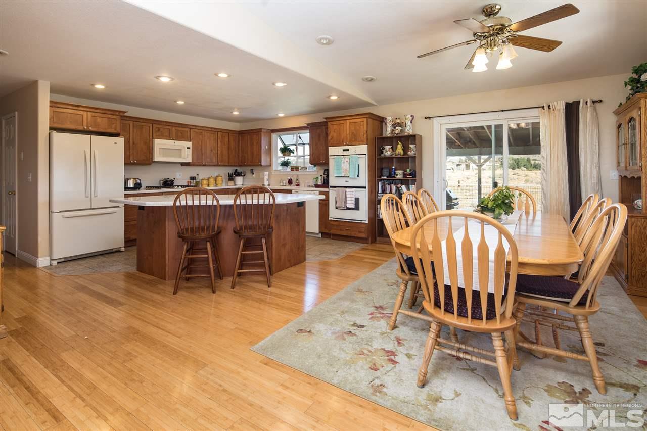 10385 Placerville Road Reno, NV 89508 - Photo 12 of 25 a dining room with furniture a rug and chandelier