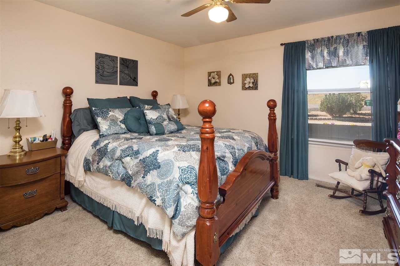 10385 Placerville Road Reno, NV 89508 - Photo 19 of 25 a bed room with a bed and a window