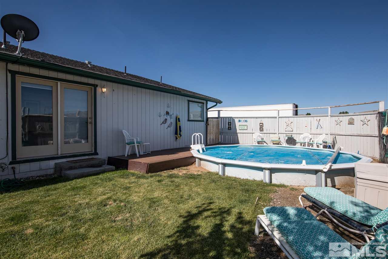 10385 Placerville Road Reno, NV 89508 - Photo 20 of 25 a wooden bench sitting in backside of a house