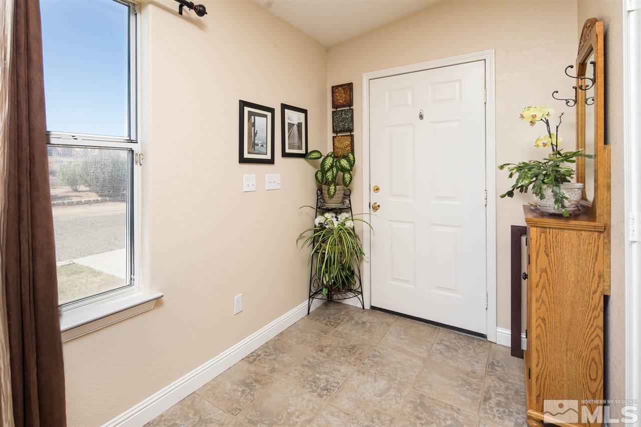 10385 Placerville Road Reno, NV 89508 - Photo 25 of 25 a view of a hallway with closet and wooden floor