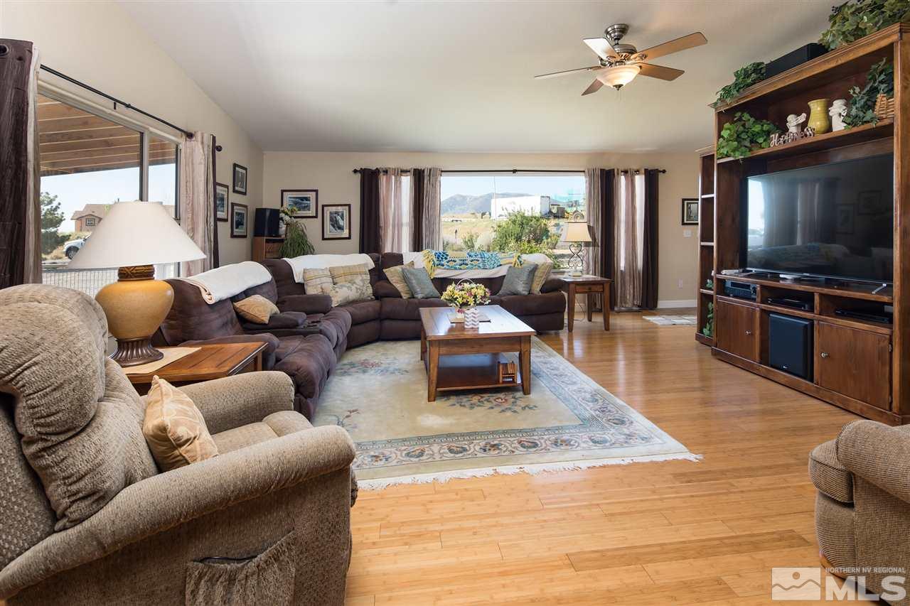 10385 Placerville Road Reno, NV 89508 - Photo 8 of 25 a living room with furniture a large window and a flat screen tv