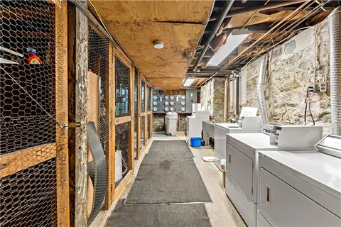 a view of a bathroom with a sink and wooden floor