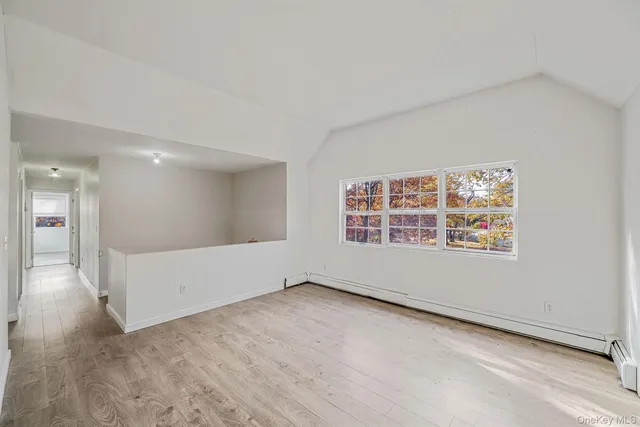 an empty room with a empty space and window