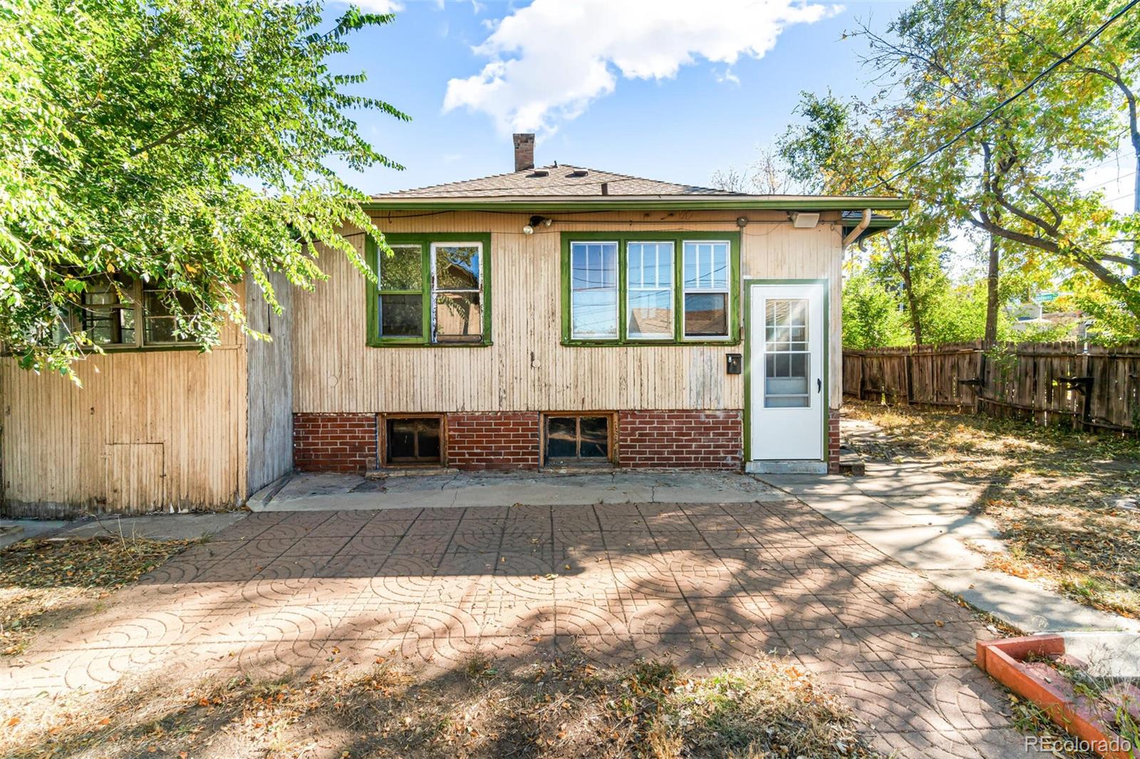 2089 South Logan Street Denver, CO 80210 - Photo 12 of 41 a view of a house with a yard