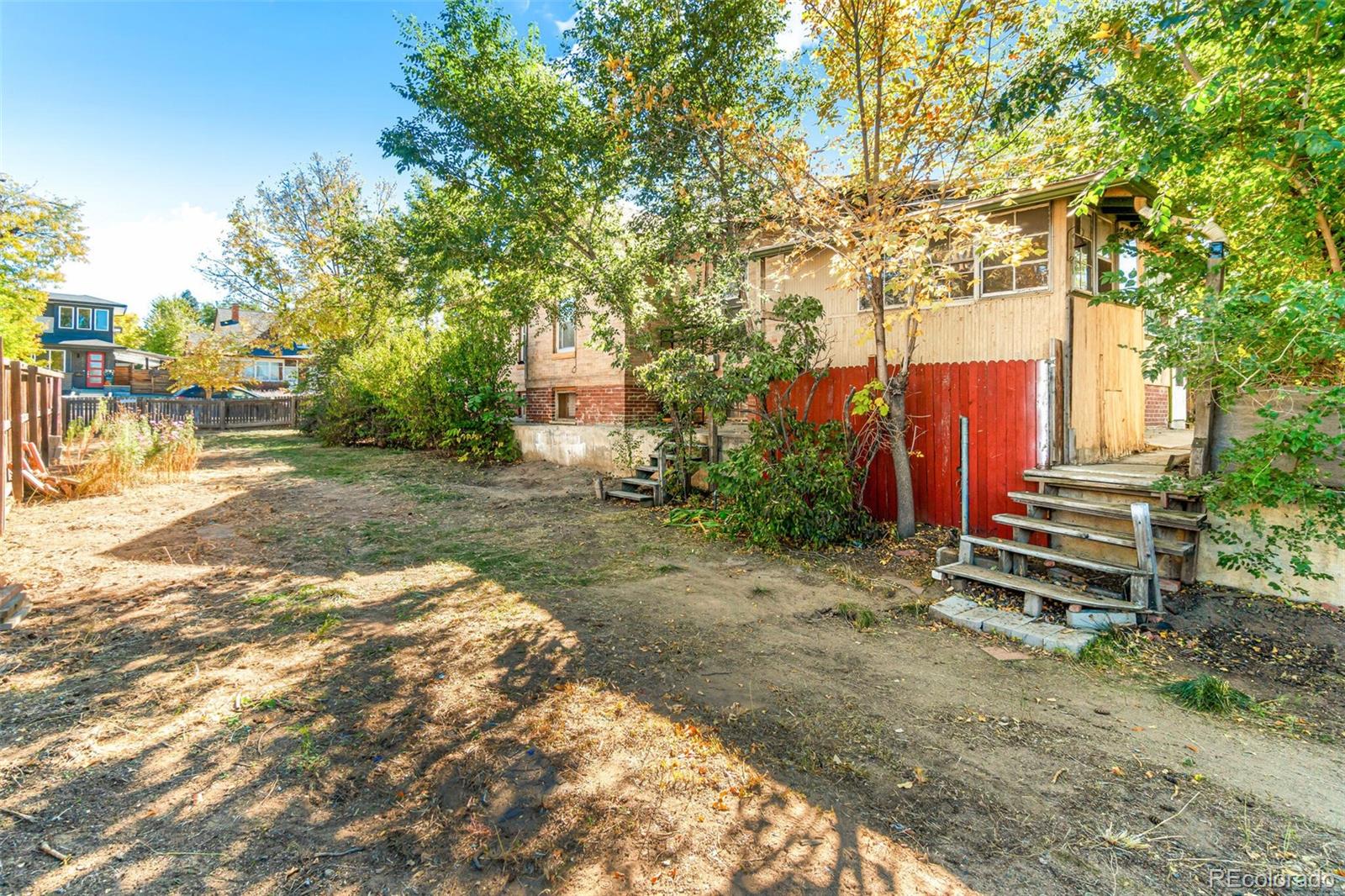 2089 South Logan Street Denver, CO 80210 - Photo 13 of 41 a backyard of a house with barbeque oven