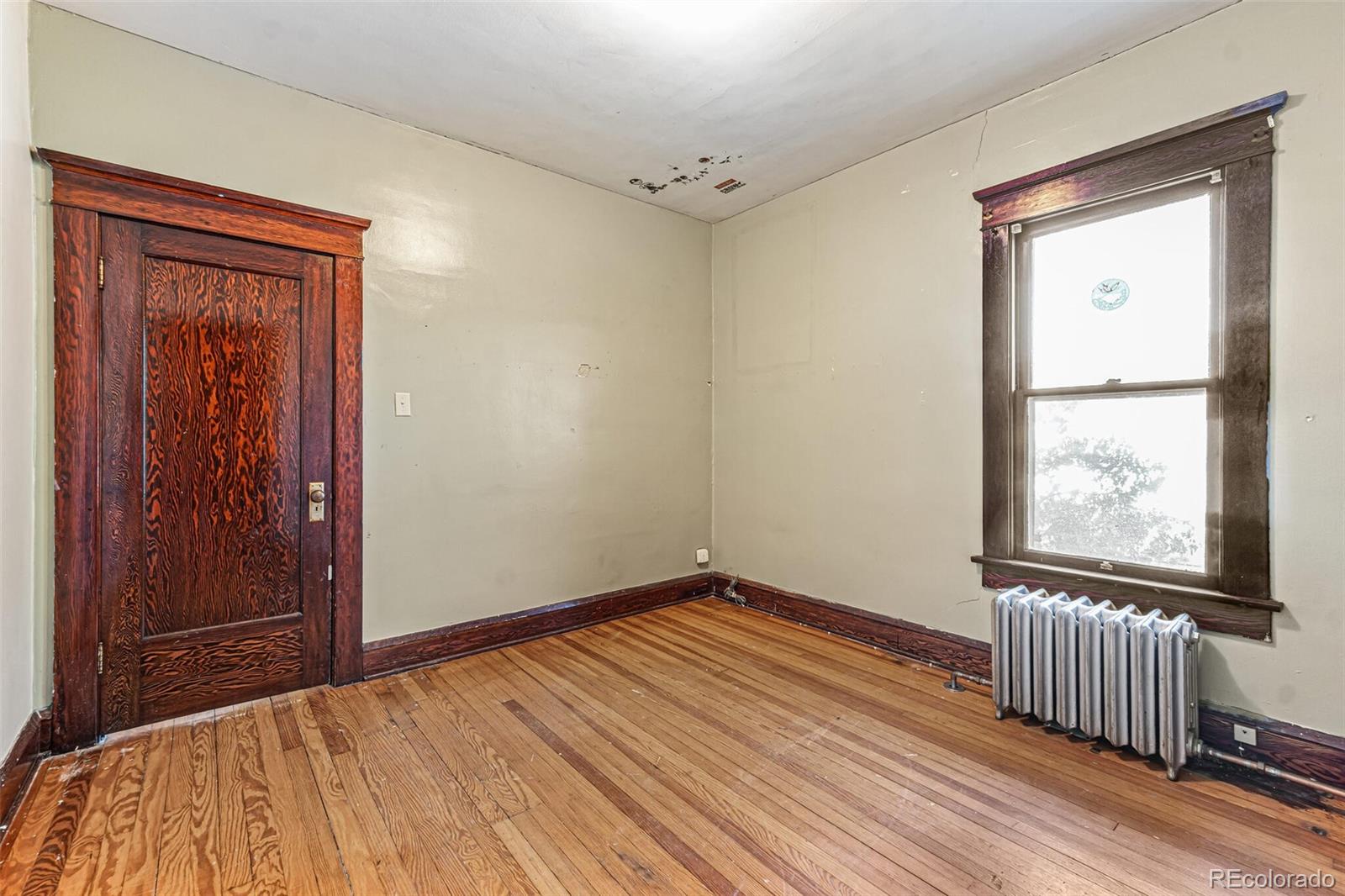 2089 South Logan Street Denver, CO 80210 - Photo 24 of 41 wooden floor and windows in a room