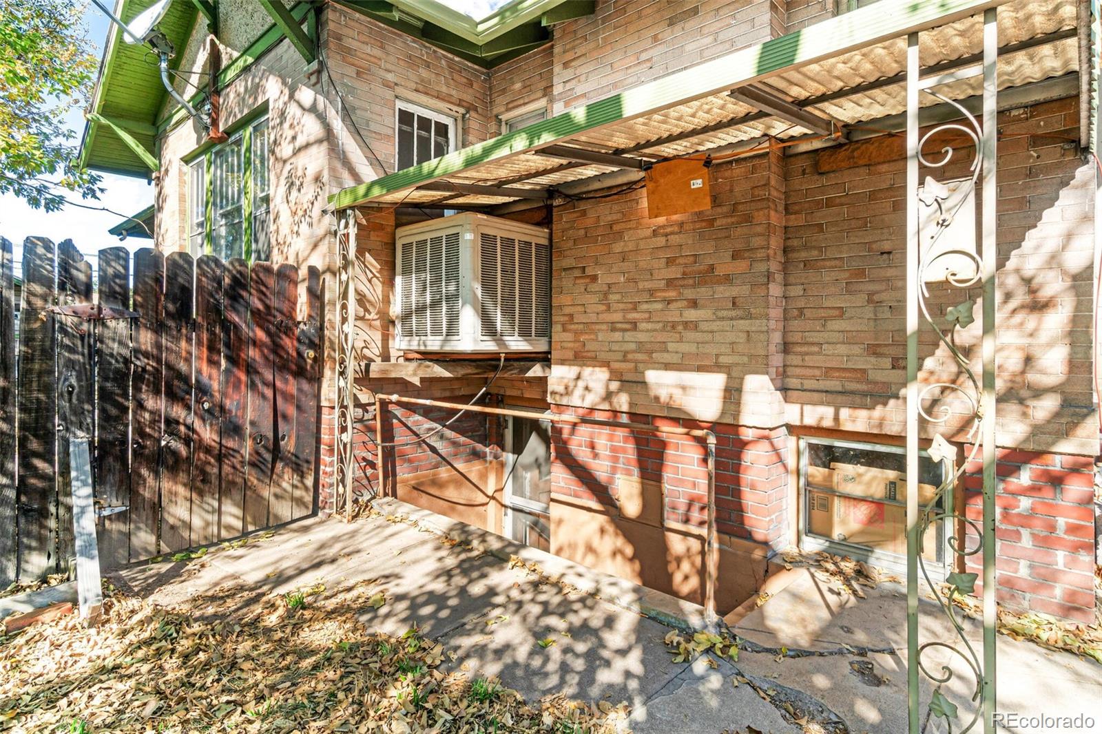 2089 South Logan Street Denver, CO 80210 - Photo 29 of 41 a view of a house with a yard