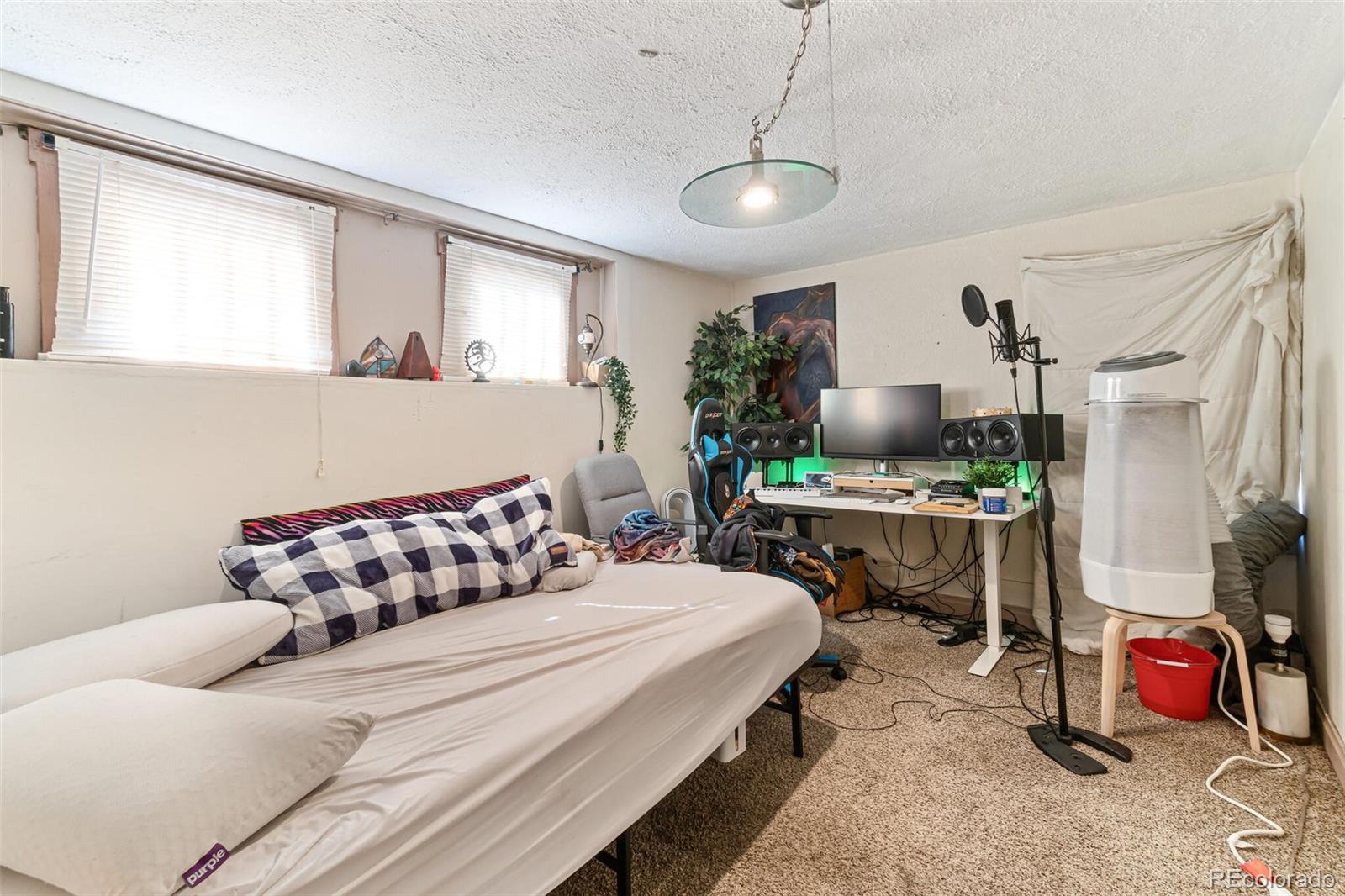 2089 South Logan Street Denver, CO 80210 - Photo 36 of 41 a bedroom with a bed and a couch