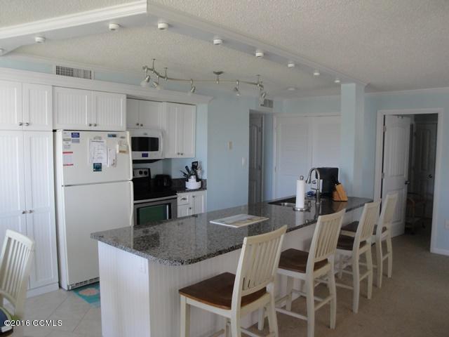 1505 Salter Path Road, Unit 420 Indian Beach, NC 28512 - Photo 3 of 15 Extra cabinets added. Laundry room enclosed off kitchen.