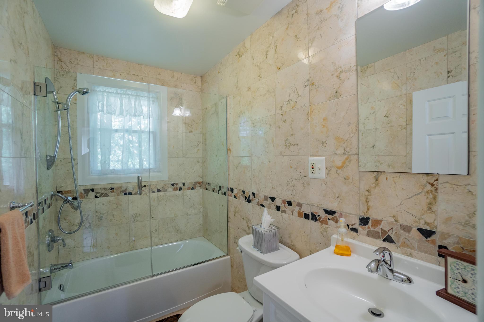 285 Shoemaker Road Huntingdon Valley, PA 19006 - Photo 12 of 46 a bathroom with a sink mirror toilet and bathtub