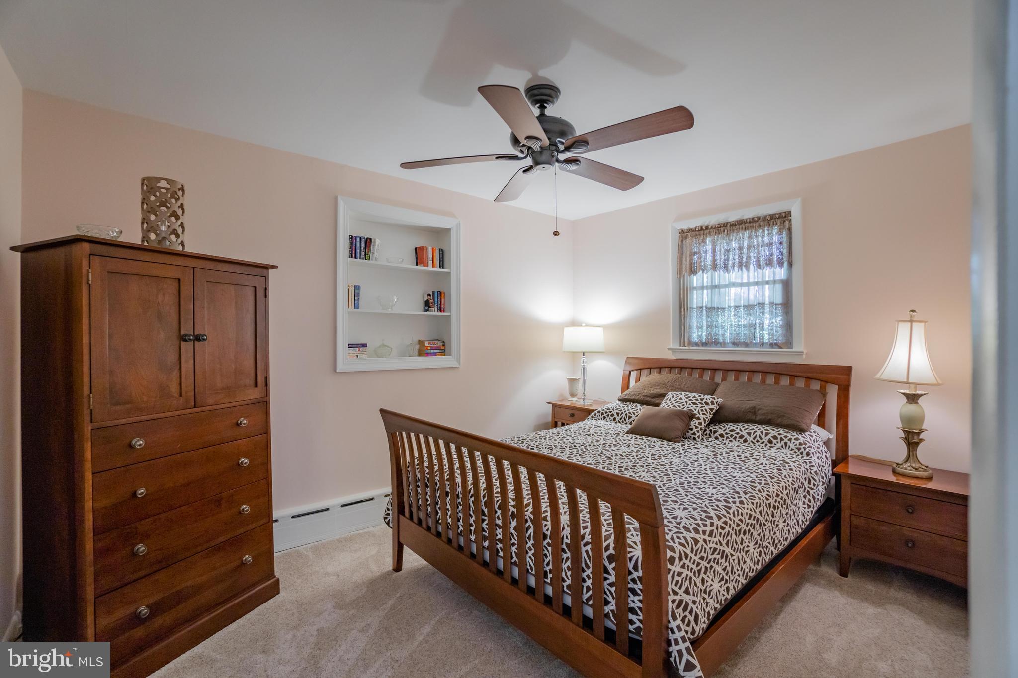 285 Shoemaker Road Huntingdon Valley, PA 19006 - Photo 15 of 46 a bedroom with a bed and a window