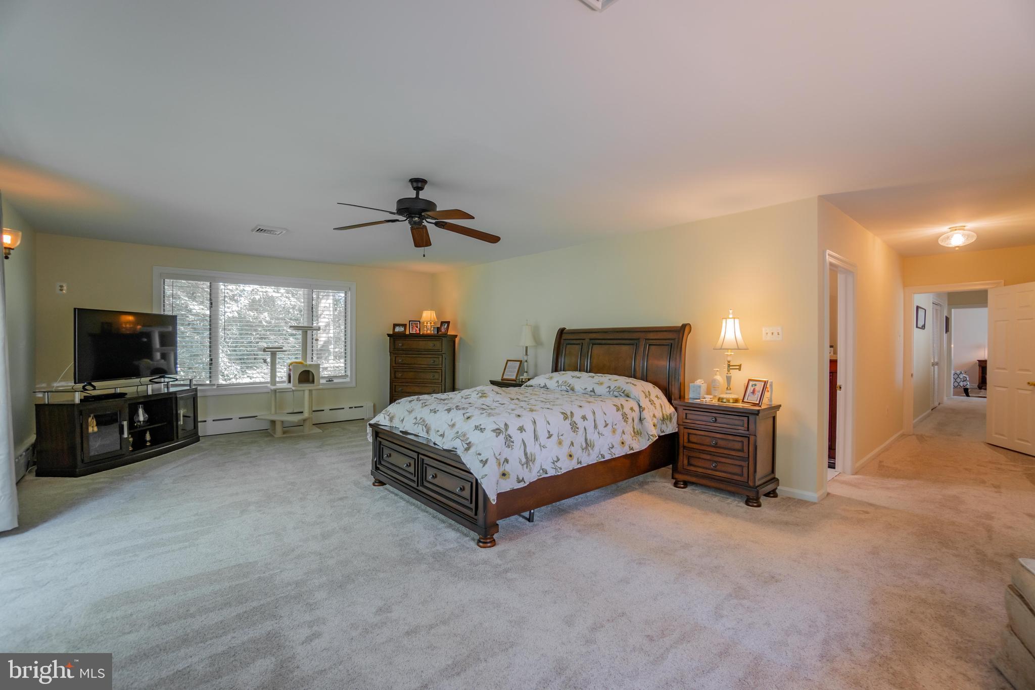 285 Shoemaker Road Huntingdon Valley, PA 19006 - Photo 16 of 46 a bedroom with a bed and a flat screen tv