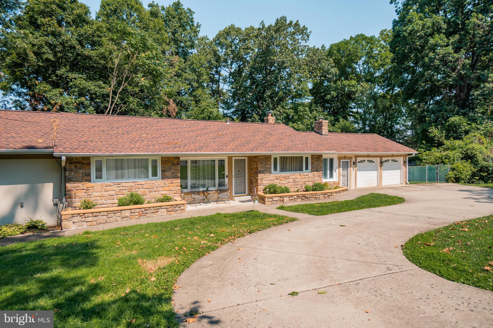285 Shoemaker Road Huntingdon Valley, PA 19006 - Photo 37 of 46 a view of a house with a yard patio and a small yard