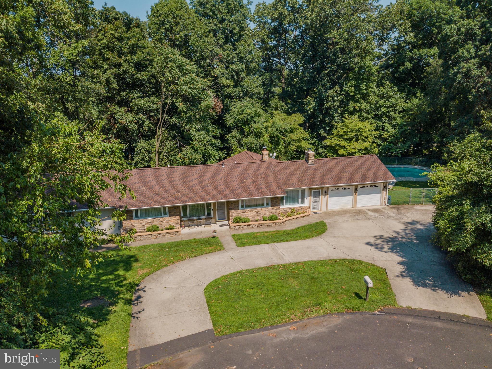 285 Shoemaker Road Huntingdon Valley, PA 19006 - Photo 38 of 46 an aerial view of a house with garden space and a patio