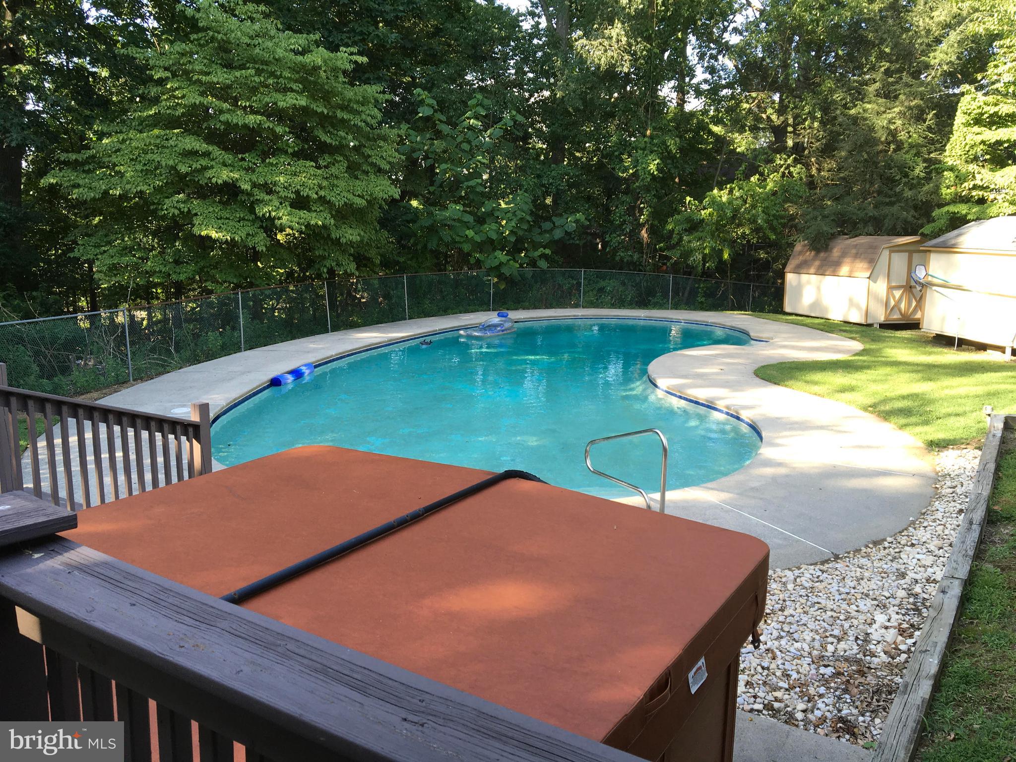 285 Shoemaker Road Huntingdon Valley, PA 19006 - Photo 6 of 46 a view of a swimming pool with a patio