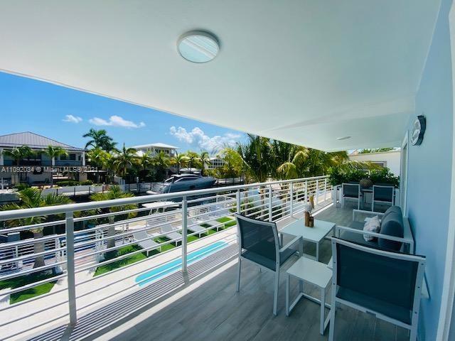 203 Atlantic Boulevard, Unit 203 Key Largo, FL 33037 - Photo 12 of 41 a outdoor view with a sitting space