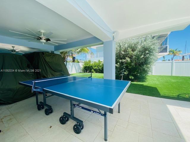 203 Atlantic Boulevard, Unit 203 Key Largo, FL 33037 - Photo 21 of 41 a room with pool table and windows