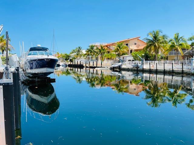 203 Atlantic Boulevard, Unit 203 Key Largo, FL 33037 - Photo 24 of 41 a view of a lake from a building