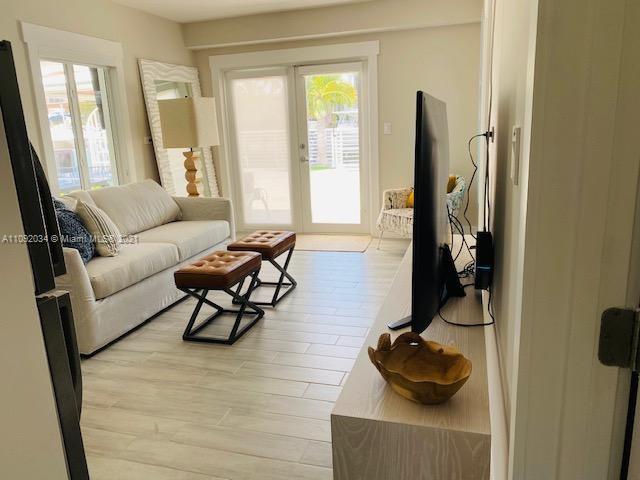 203 Atlantic Boulevard, Unit 203 Key Largo, FL 33037 - Photo 25 of 41 a living room with furniture and a window