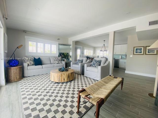 203 Atlantic Boulevard, Unit 203 Key Largo, FL 33037 - Photo 27 of 41 a living room with furniture and a wooden floor