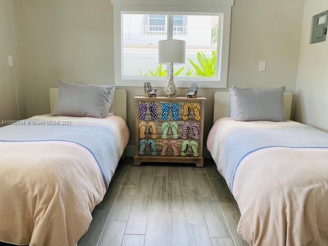 203 Atlantic Boulevard, Unit 203 Key Largo, FL 33037 - Photo 33 of 41 a bed sitting in a bedroom next to a window