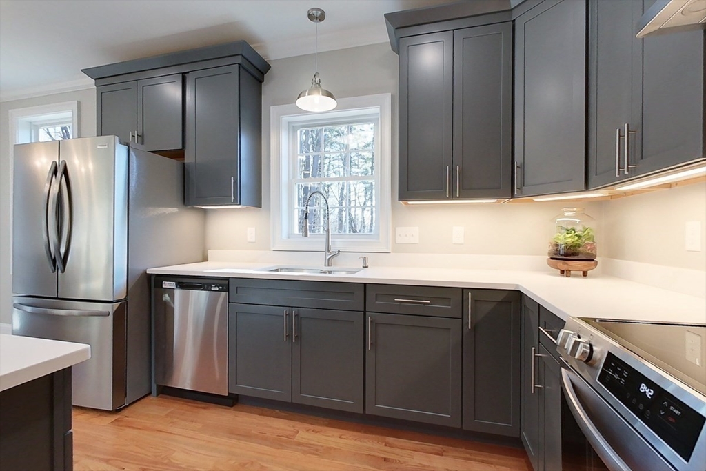 531 Clark Street Gardner, MA 01440 - Photo 3 of 42 a kitchen with stainless steel appliances granite countertop a sink stove and refrigerator