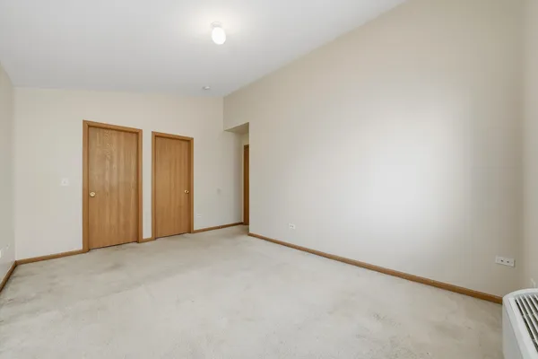 a view of an empty room and a window