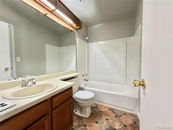 a bathroom with a sink a toilet and a bathtub