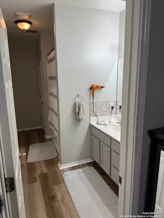 a bathroom with a sink and mirror