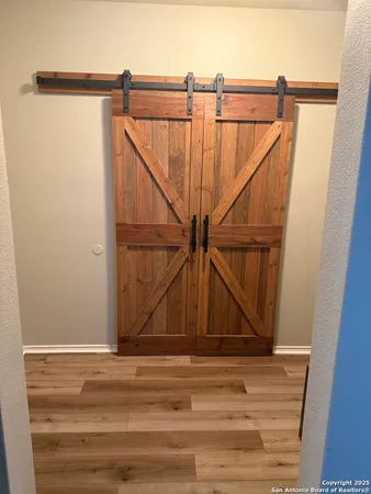 a view of a room with stairs and wooden floor