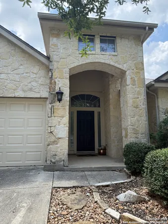a front view of a house with yard