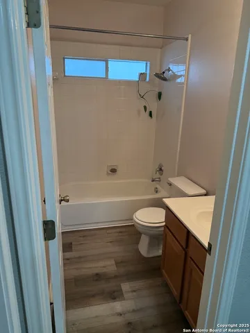 a bathroom with a toilet a sink and bathtub
