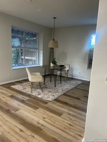 a dining room with a table and chairs