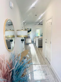 a room with a sink and a mirror