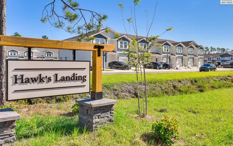 a view of a swimming pool and trees