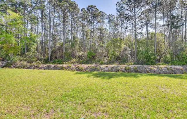 a view of a street with a building in the background