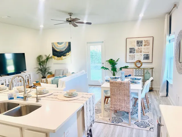 a dining room with furniture and wooden floor