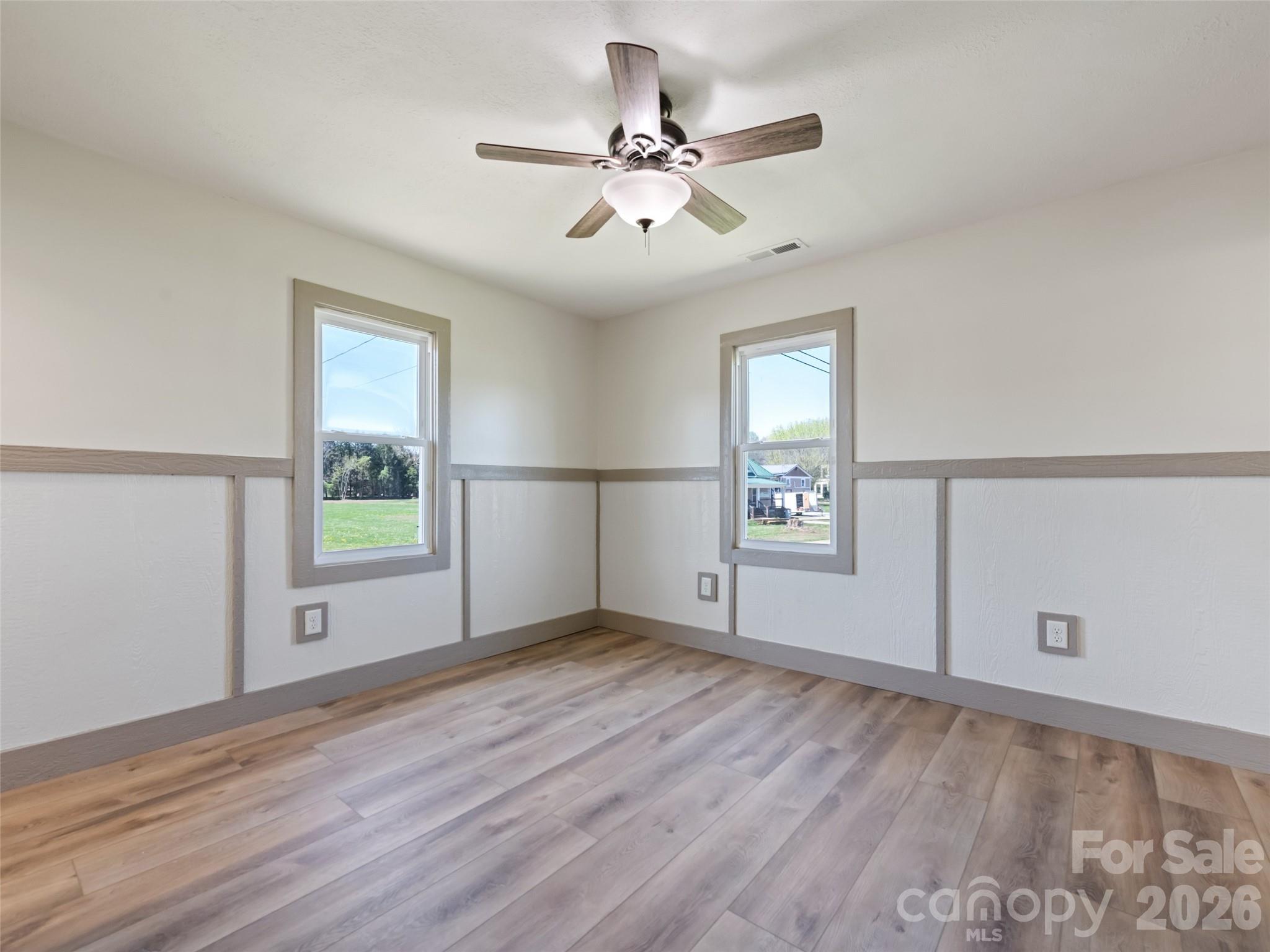 13 Depot Street Clyde, NC 28721 - Photo 19 of 21 wooden floor in an empty room with a window