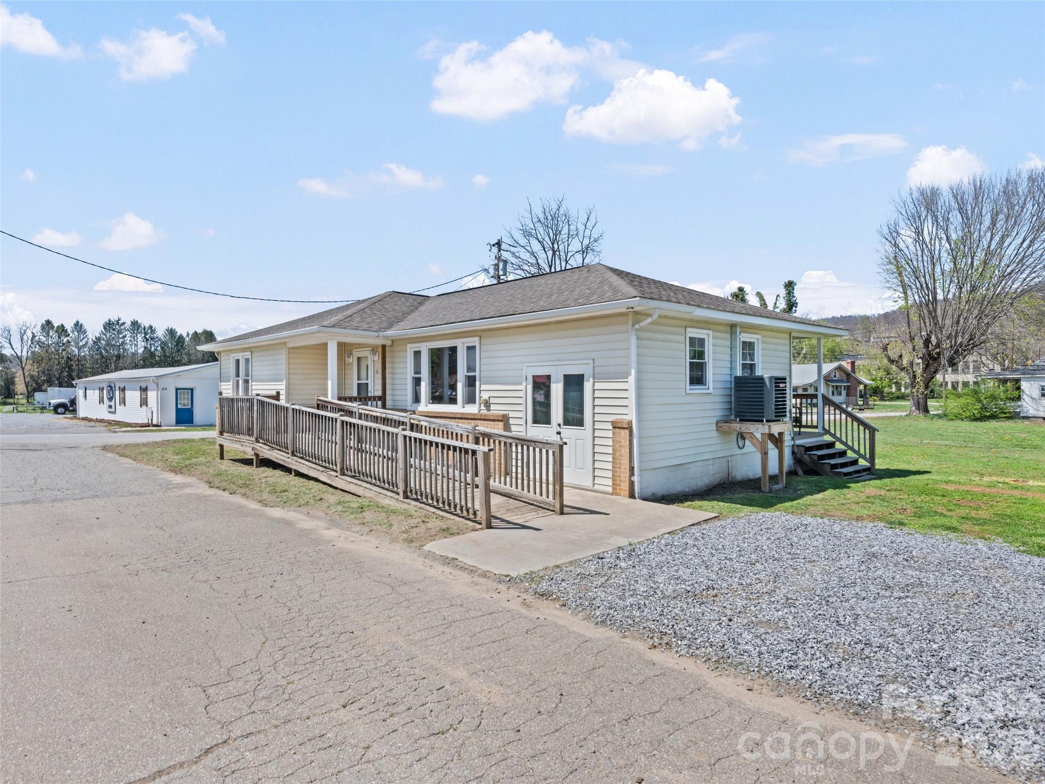 13 Depot Street Clyde, NC 28721 - Photo 2 of 21 a view of a house with a yard and sitting area