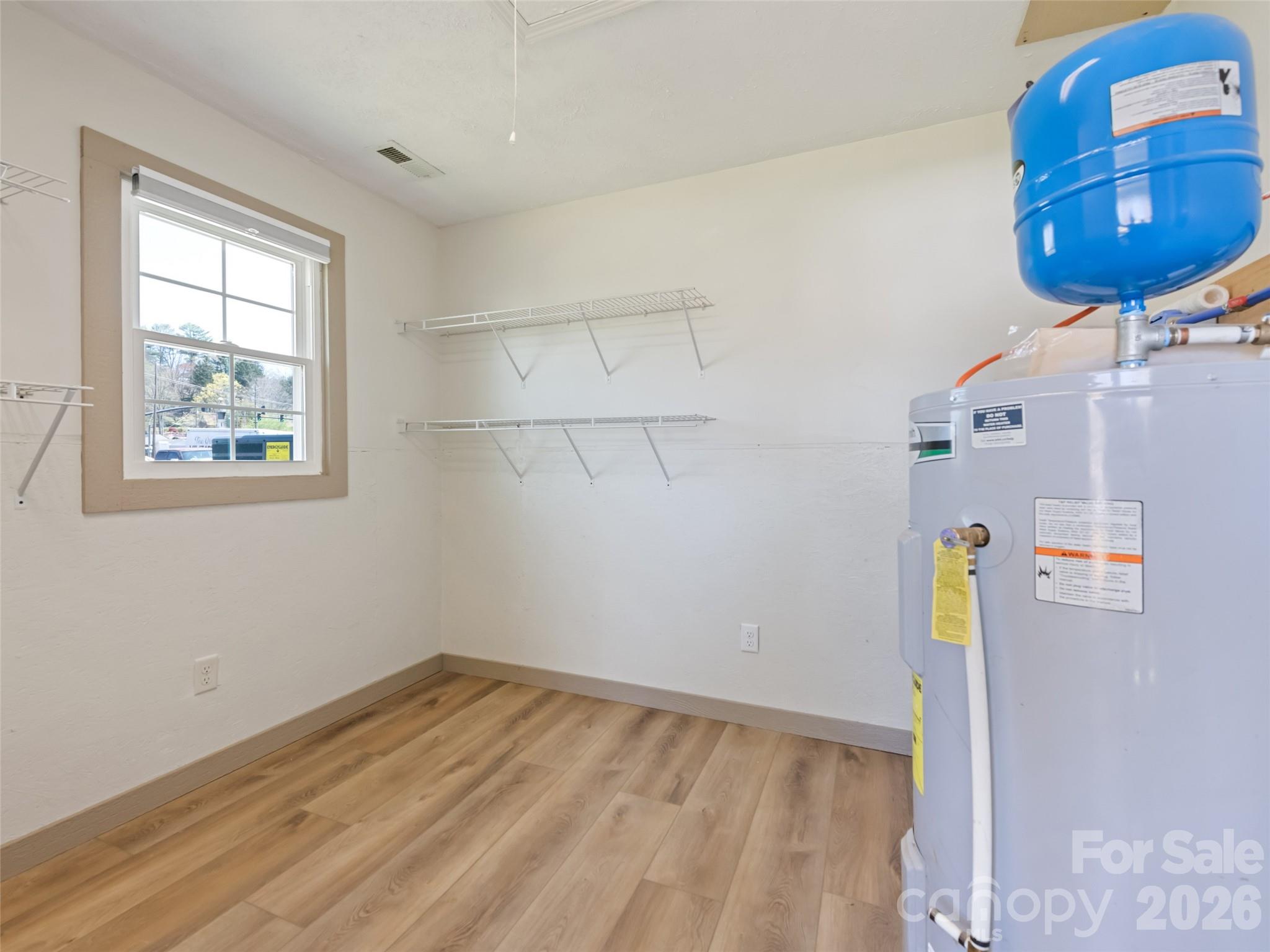 13 Depot Street Clyde, NC 28721 - Photo 21 of 21 a view of storage and utility room with a window